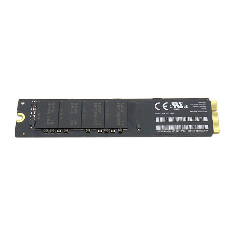 Black internal solid-state drive with a sleek design, featuring multiple memory chips and a gold connector for installation, labeled with CE and other regulatory markings.