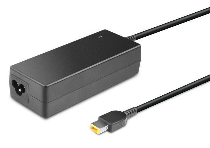 Black rectangular power adapter with a glossy finish, featuring a circular input port and a right-angle connector, labeled "CoreParts Power Dper. 90W 20V 4.5".