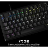 Black Corsair K70 CORE RGB gaming keyboard with colorful backlit keys, USB connection, and UK QWERTY layout.
