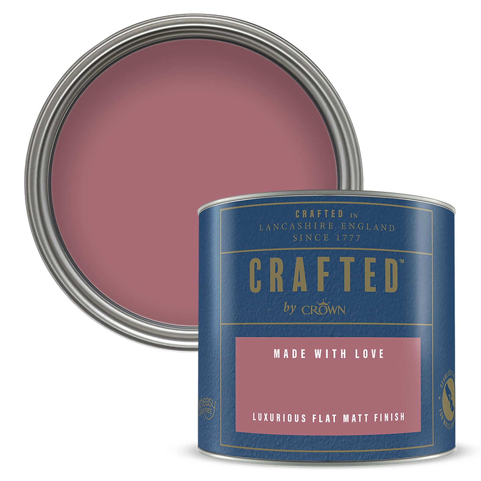 Round tin of "Crafted by Crown" flat matt emulsion paint in a muted pink shade, featuring a blue label with gold accents and the text "Made with Love" prominently displayed.