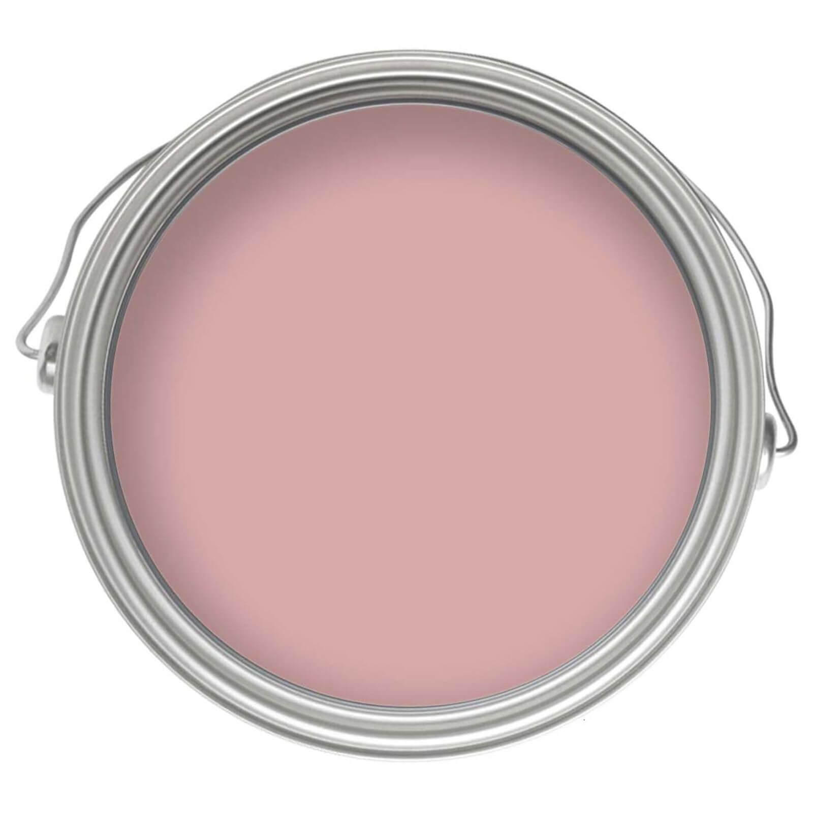 Round metal paint can with a silver lid, showcasing a smooth, rose pink eggshell paint finish, labeled for durable interior use on wood and metal.