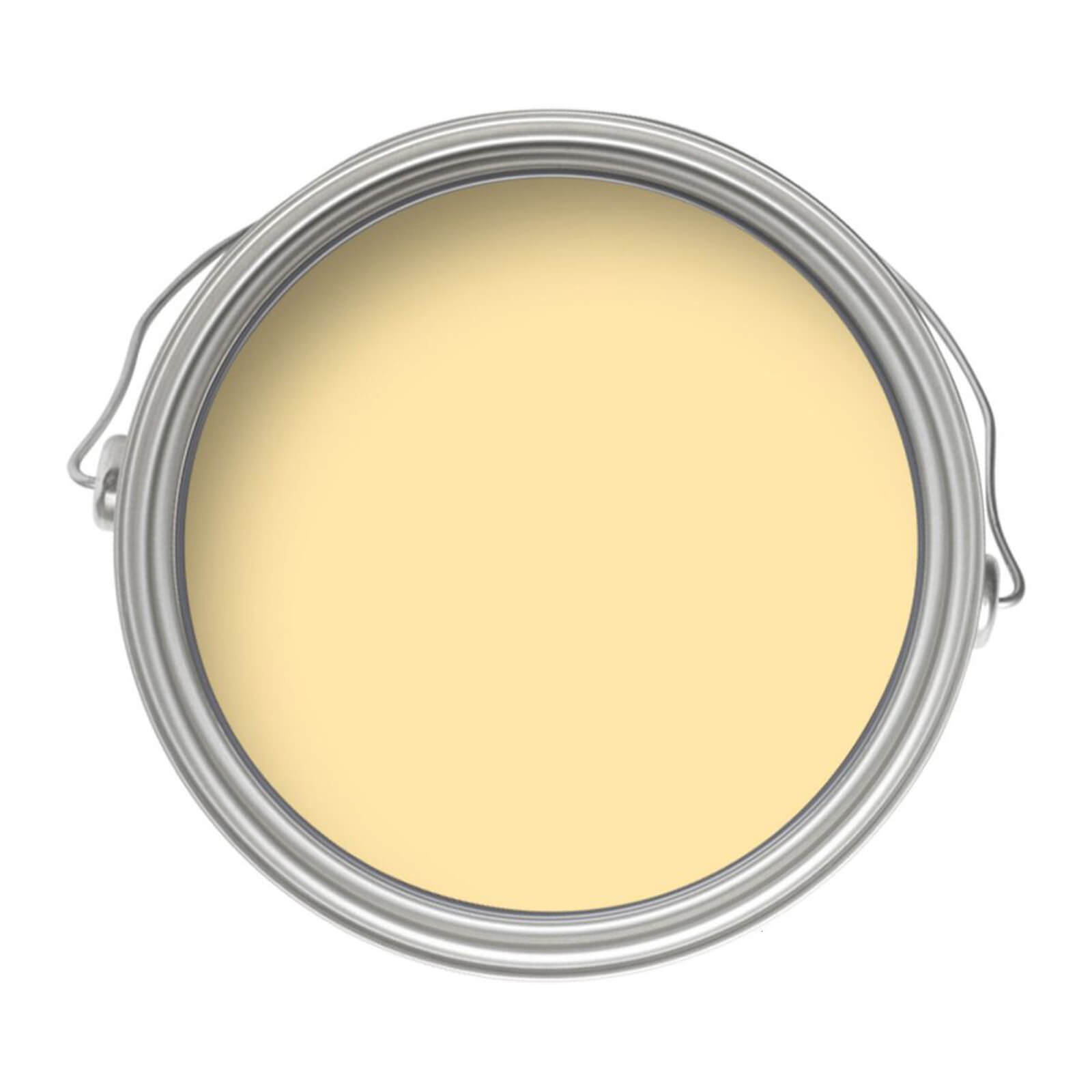 Crown Walls and Ceilings Silk Emulsion Paint in Sunrise, 2.5L, features a smooth, creamy yellow color inside a round metal paint can with a silver rim.