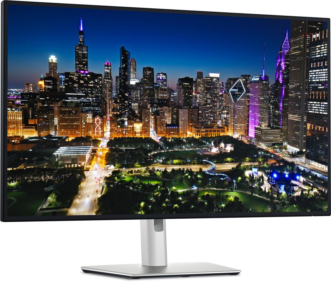 32-inch Dell UltraSharp 4K monitor with a sleek black bezel, silver stand, and vibrant city skyline display, showcasing rich colors and sharp details.