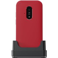 Red and white Doro Leva E22 feature phone on a black charging dock, rear view showing camera and flash.
