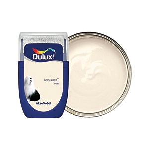 Dulux Colour Tester in Ivory Lace, 30ML, features a creamy off-white paint in a small, round tin with a blue label and a silver lid, showcasing the smooth texture.