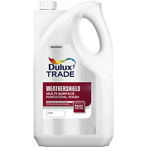 White plastic container with a handle, labeled "Dulux Trade Weathershield Multi-Surface Fungicidal Wash 5L," featuring a colorful logo and clear usage instructions.