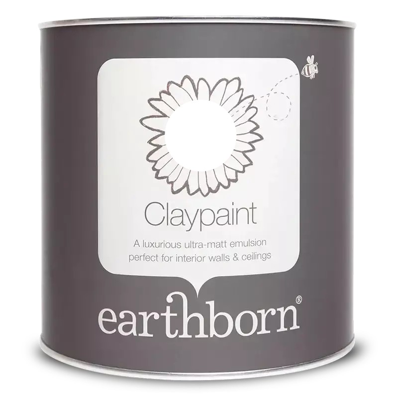 Round tin of Earthborn Claypaint in Delilah, featuring a dark gray label with a white flower graphic and text, emphasizing eco-friendly, breathable, ultra-matt emulsion for walls and ceilings.