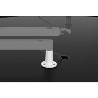 White Elgato 10AAX9911 microphone desk mount with circular base and cable port on a black surface.