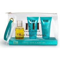 Clear pouch with Emma Hardie hand and body set, includes oil bottle and two teal tubes with EH logo.