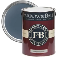 Farrow & Ball Exterior Masonry Paint, Stiffkey Blue No. 281, in an open maroon and cream can with visible blue paint.