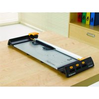 Black and silver Fellowes Proton A3/180 paper cutter with yellow accents and a white cutting arm on a wooden table.