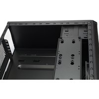 Black Fractal Design Core 1100 Mini Tower with open side panel, showing internal drive bays and ventilation slots.