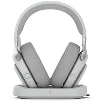 White Fractal Design Scape Light wireless gaming headset with cushioned ear cups on a sleek charging stand.