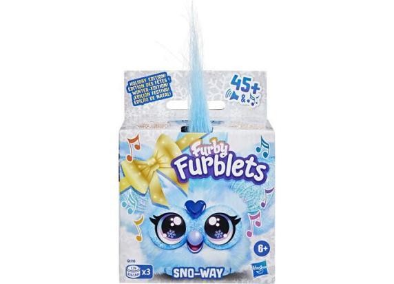Furby Furblets Sno-Way mini electronic pet in a snowy-themed box, featuring a light blue color, large expressive eyes, and a fluffy blue tuft on top, with musical notes and a bow design.
