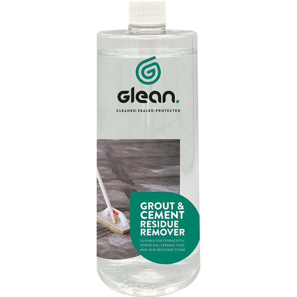 Clear plastic bottle containing 1 litre of GLEAN Grout & Cement Residue Remover, featuring a green logo and label with a mop graphic, suitable for various tile materials.