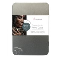 Hahnemühle photo paper Gloss in a sleek silver tin with a label featuring a woman's portrait and product details.