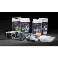 Hahnemühle White Pearl photo paper packs with camera, showing glossy sheets and spiral design packaging.