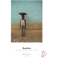 Hahnemühle Bamboo A3 white matte paper with a textured surface, featuring an image of a person balancing a basket.