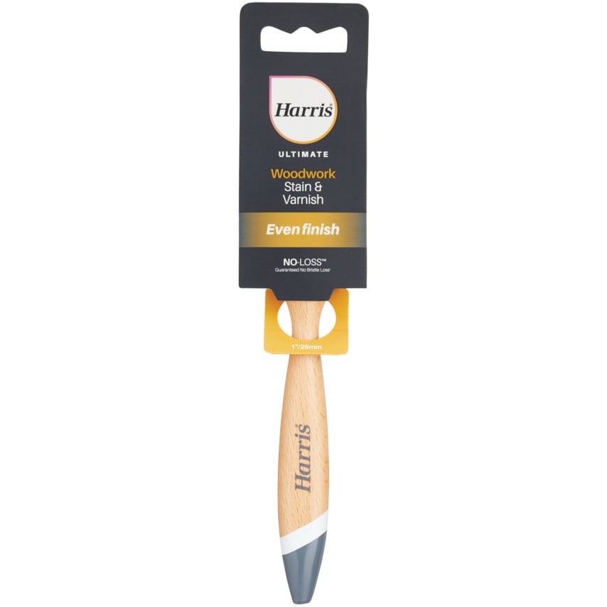 Harris Ultimate Woodwork Stain Paint Brush, 25mm, features a wooden handle with a tapered design, a grey tip, and a black and gold packaging label highlighting "Even finish."