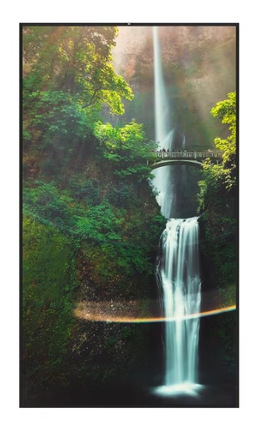 Hisense 55WH80F digital signage display features a sleek black frame, showcasing a vibrant waterfall scene with lush greenery and a bridge, ideal for advertising and presentations.