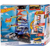 Hot Wheels City Transforming Race Tower Playset with multi-level tracks, cars, and vibrant colors in a box.