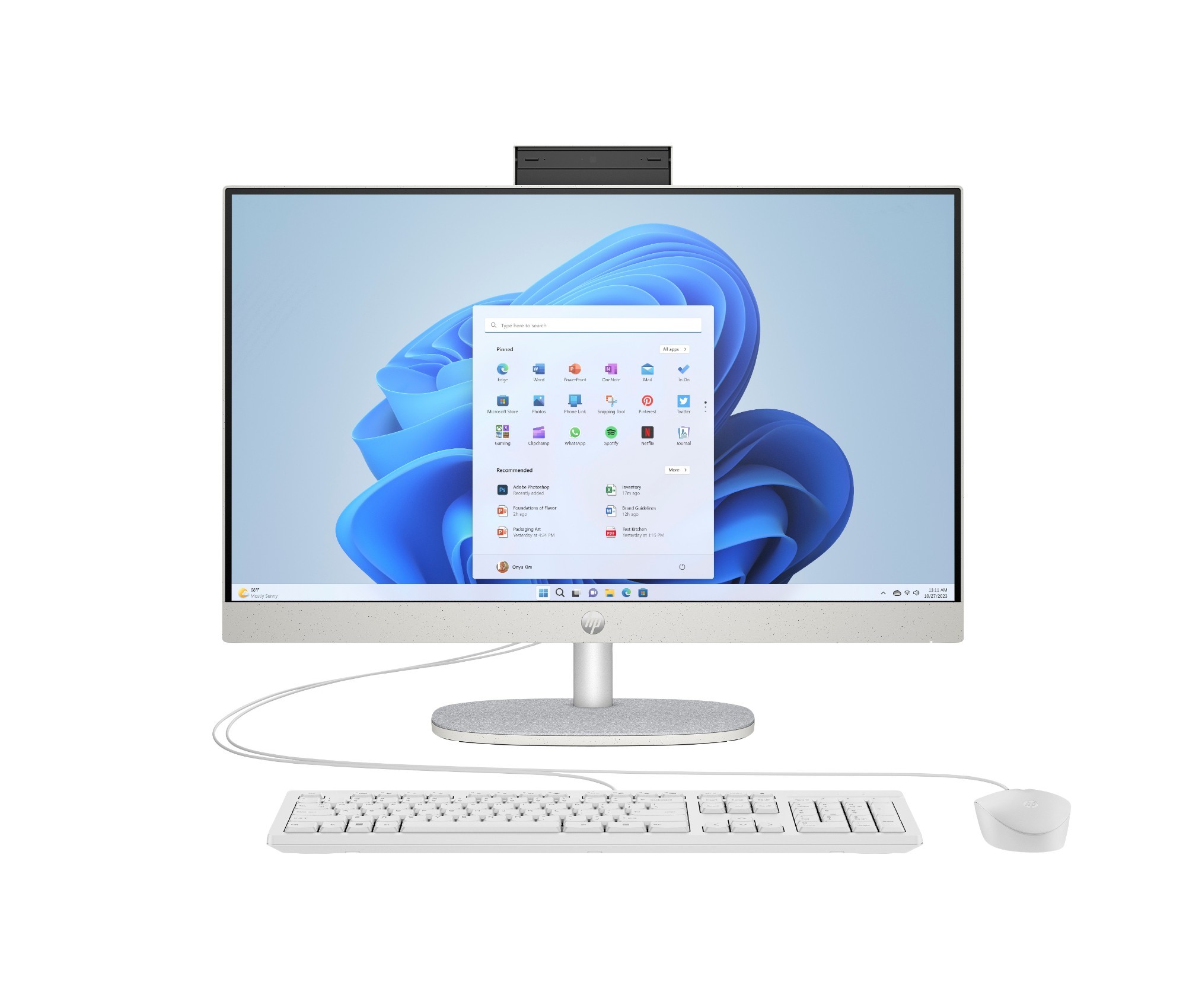 Sleek HP All-in-One desktop in silver with a 23.8-inch display, featuring a webcam on top, a white keyboard, and a mouse, set against a light blue background.