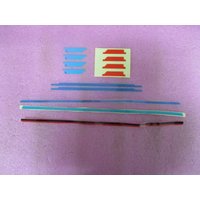 HP N00351-001 laptop frame tape set with blue, red, and clear adhesive strips on a pink surface.