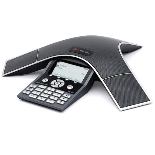HP Poly SoundStation IP 7000 conference phone in black with a sleek design, featuring a keypad, LCD screen, and multiple microphones for enhanced audio quality.