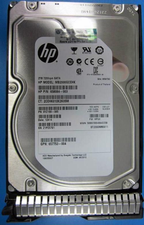 HPE 702288-B21 internal hard drive with a silver metal casing, featuring a 2 TB capacity, 7200 RPM speed, and a 3.5" Serial ATA interface, labeled with product details and barcodes.