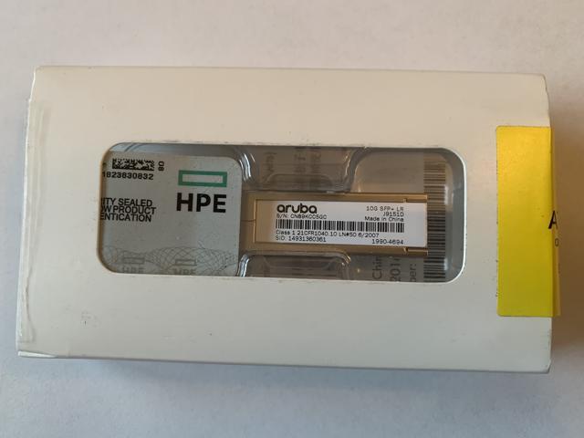 HPE 10G SFP+ LC LR transceiver in a sealed white box with a clear window, featuring labels for HPE and Aruba, designed for data networking and optical connections.