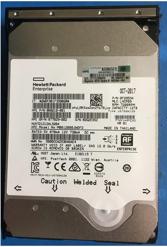 HPE DX 12TB SAS hard disk drive with a silver metal casing, featuring a label with model information, barcodes, and caution warnings on a blue background.