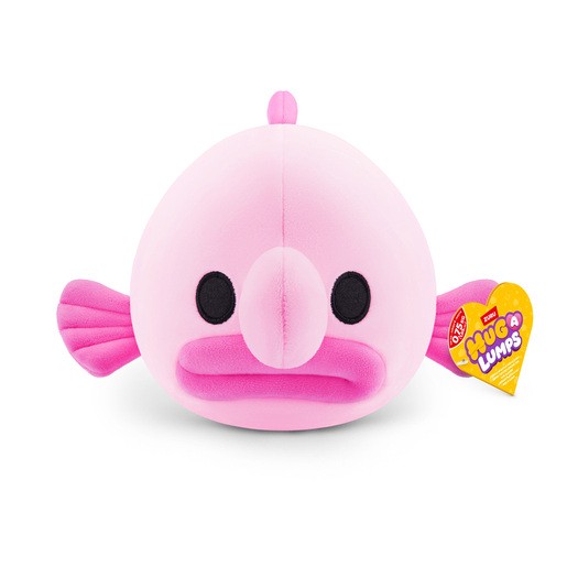 Cuddly small pink plush toy shaped like a fish with a round body, large black eyes, and a flat mouth, featuring a tag with the Hug-a-Lumps logo.
