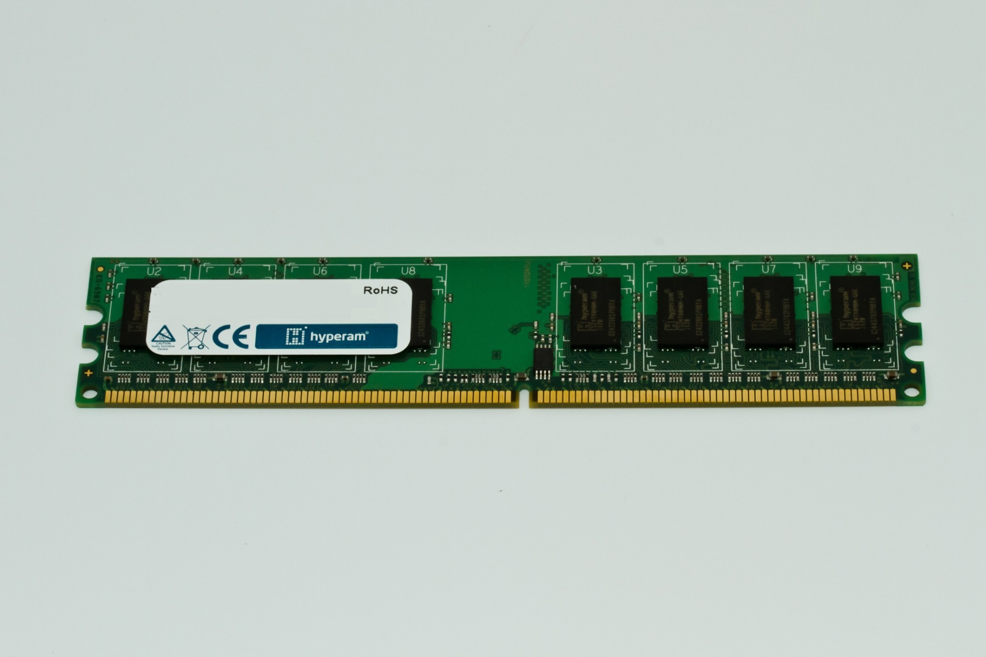 Green circuit board memory module with eight memory chips, labeled "Hypertec HYU253648512OE," featuring a gold connector edge and CE certification mark.