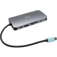 Silver i-tec USB-C travel dock with HDMI, VGA, LAN ports, and blue-tipped cable for 100W power delivery.