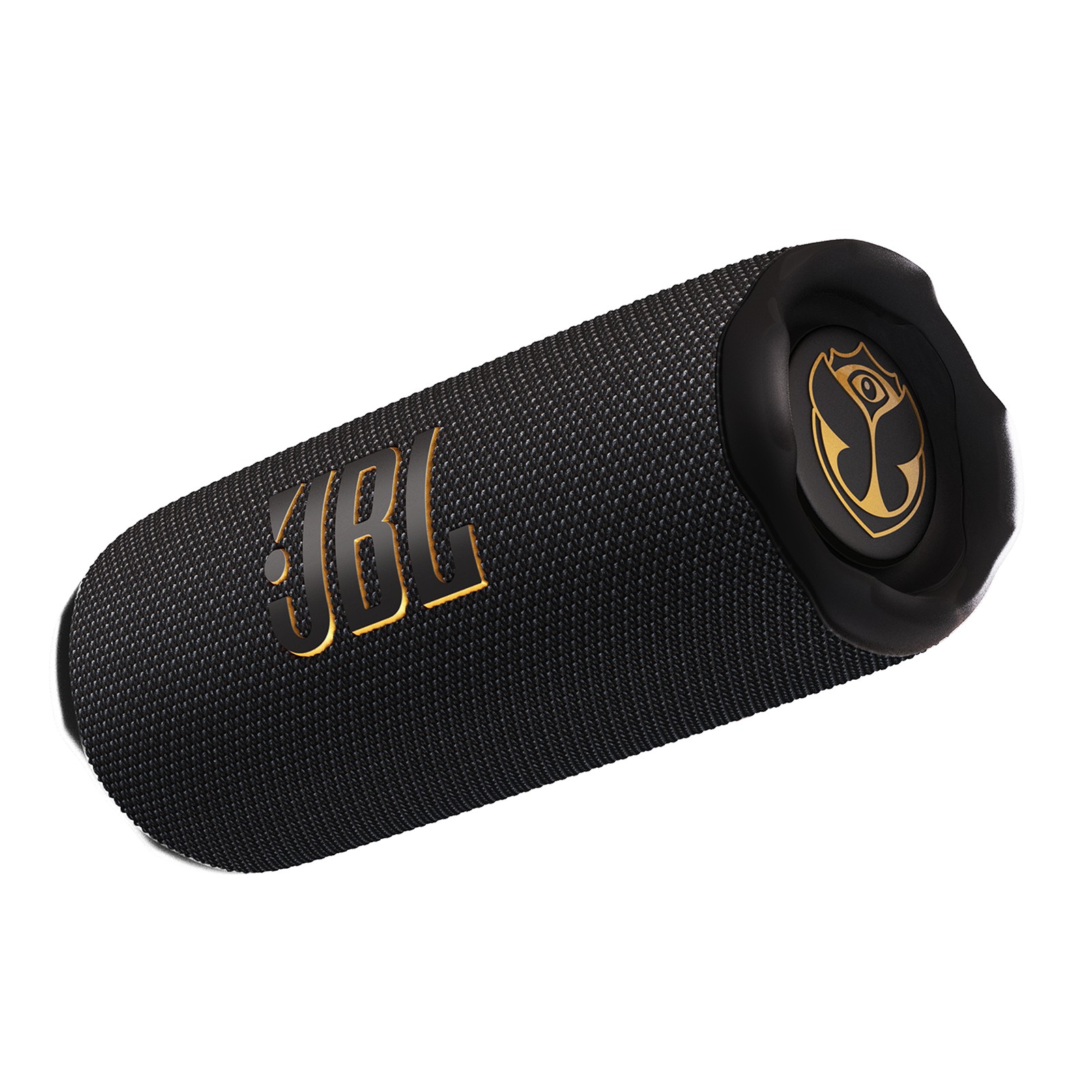 Black portable JBL Flip 7 speaker with a textured fabric exterior, featuring a gold JBL logo and Tomorrowland emblem on the end, designed for durability and enhanced sound quality.