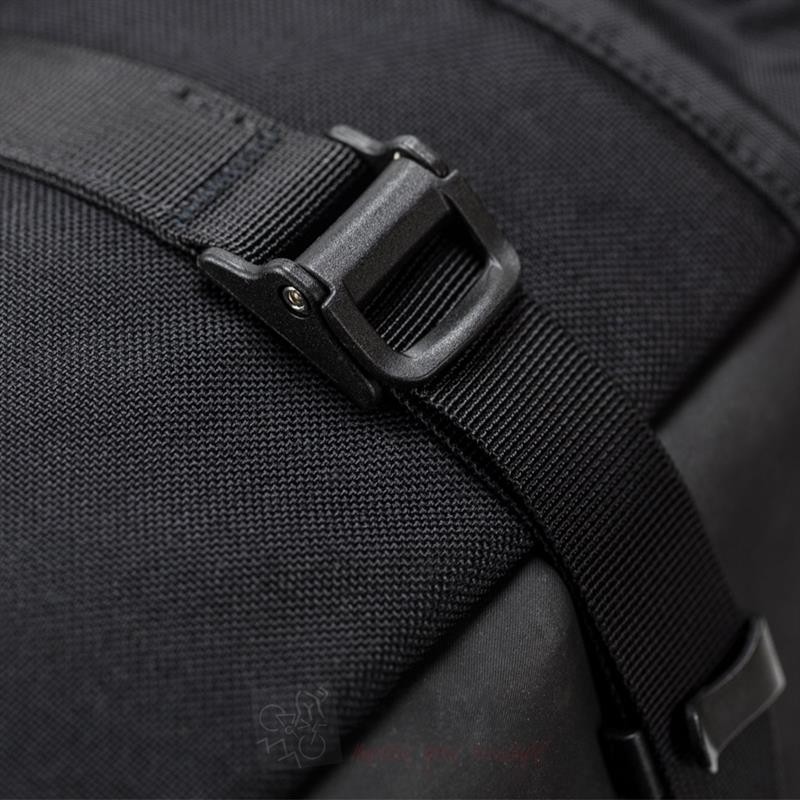 Black waterproof rear bag featuring durable fabric, adjustable strap, and a sturdy buckle for secure attachment, designed for motorcycle use.