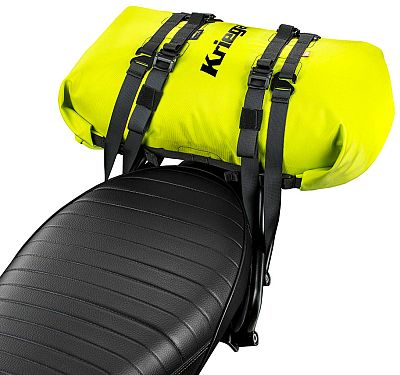 Bright neon-yellow waterproof Kriega Rollpack with a 20L capacity, secured with black straps, resting on a textured black motorcycle seat.