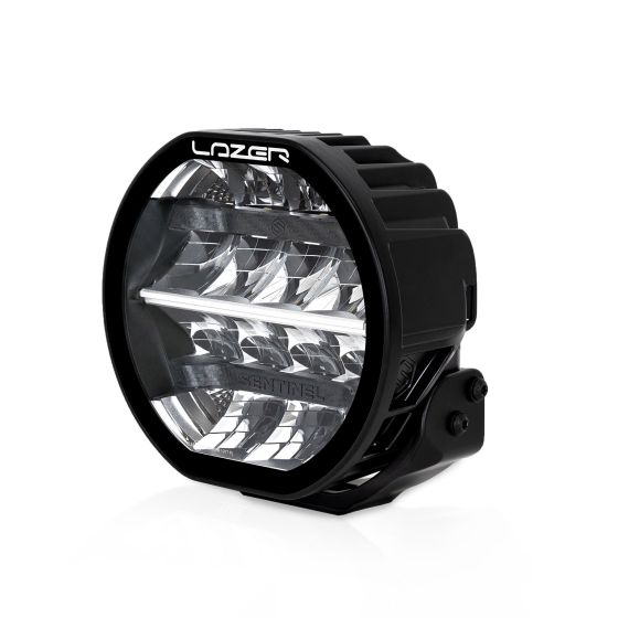 Lazer Lamps Sentinel LED light features a round, black housing with a clear lens, showcasing multiple reflective elements for enhanced brightness and a sturdy mounting bracket.