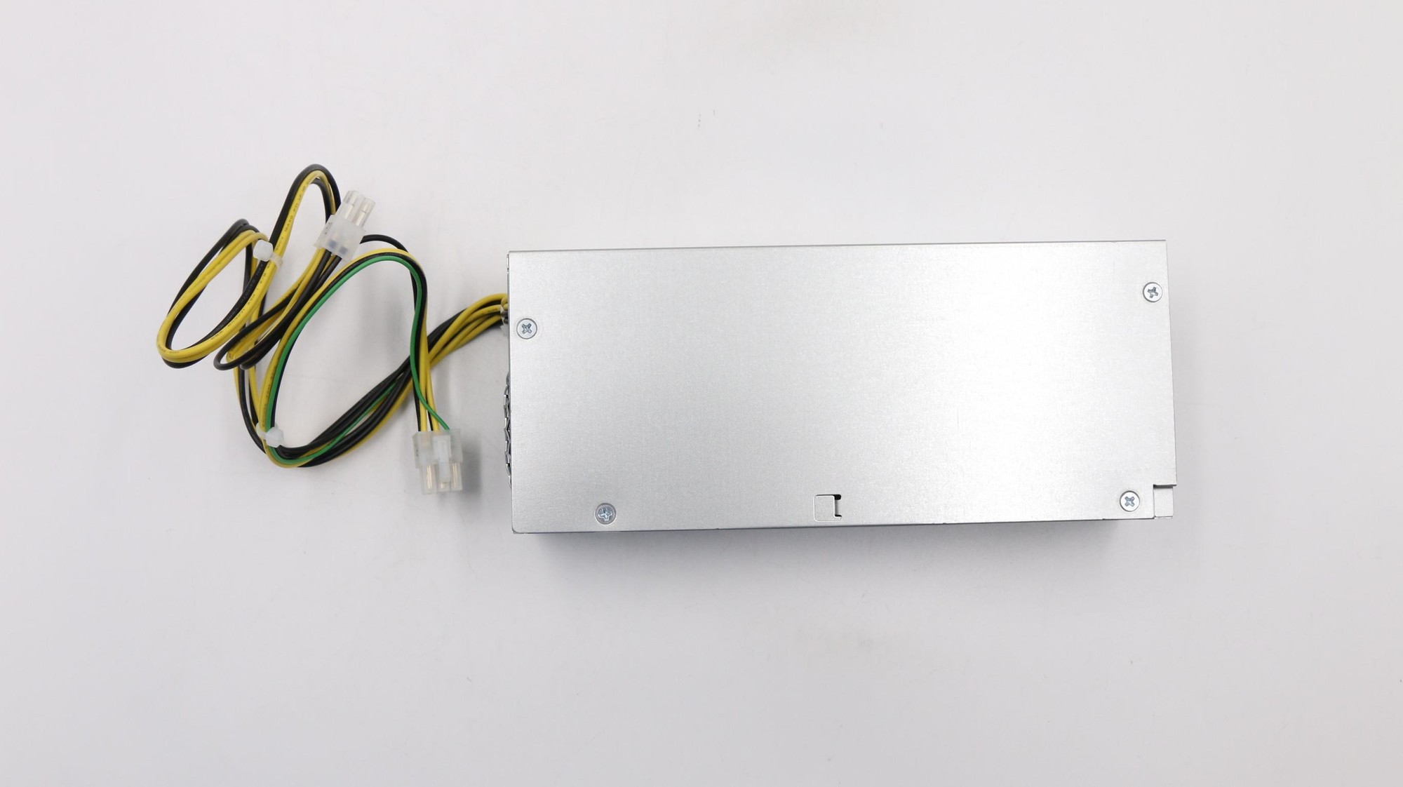 Lenovo 00PC780 Power Supply Unit in silver, featuring a compact metal casing with multiple wires attached in green, yellow, and black.
