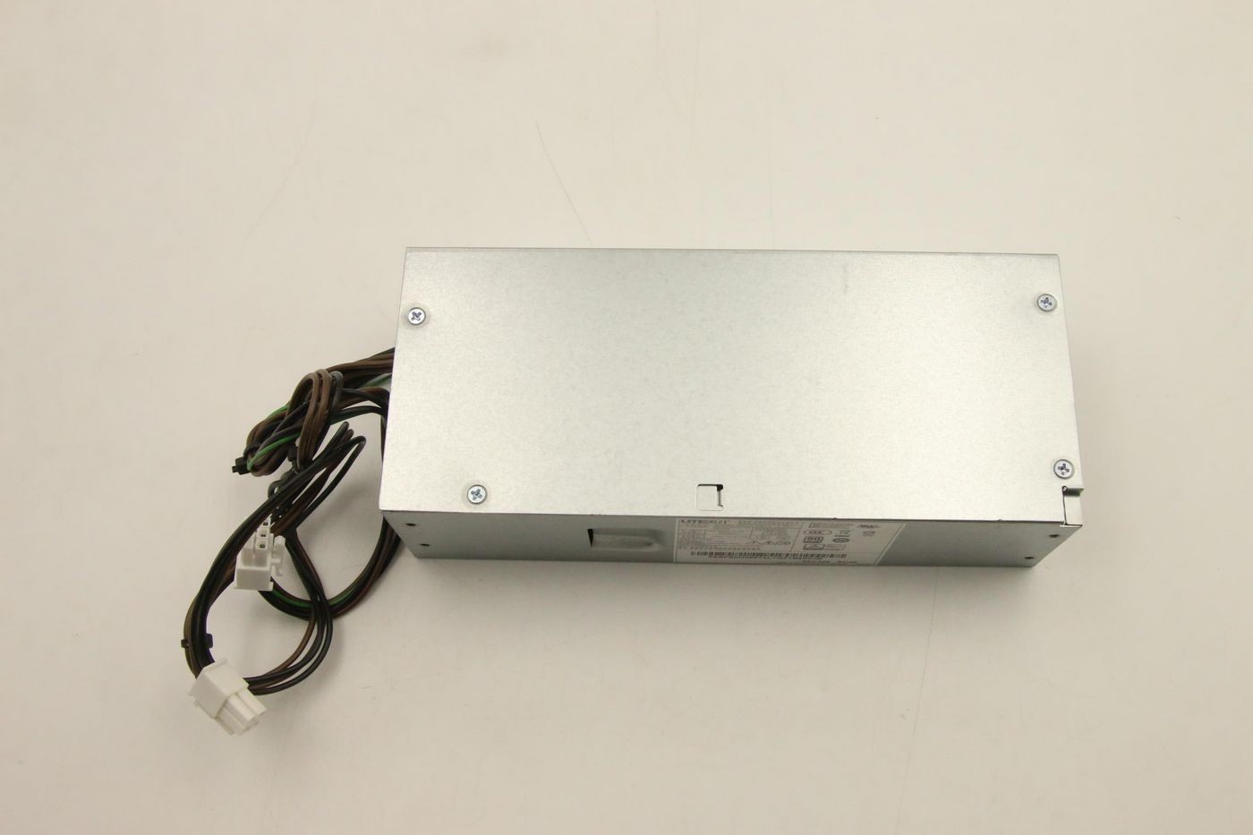Silver Lenovo 260W power supply unit with multiple cables and connectors, featuring a flat rectangular design and ventilation slots on one side.