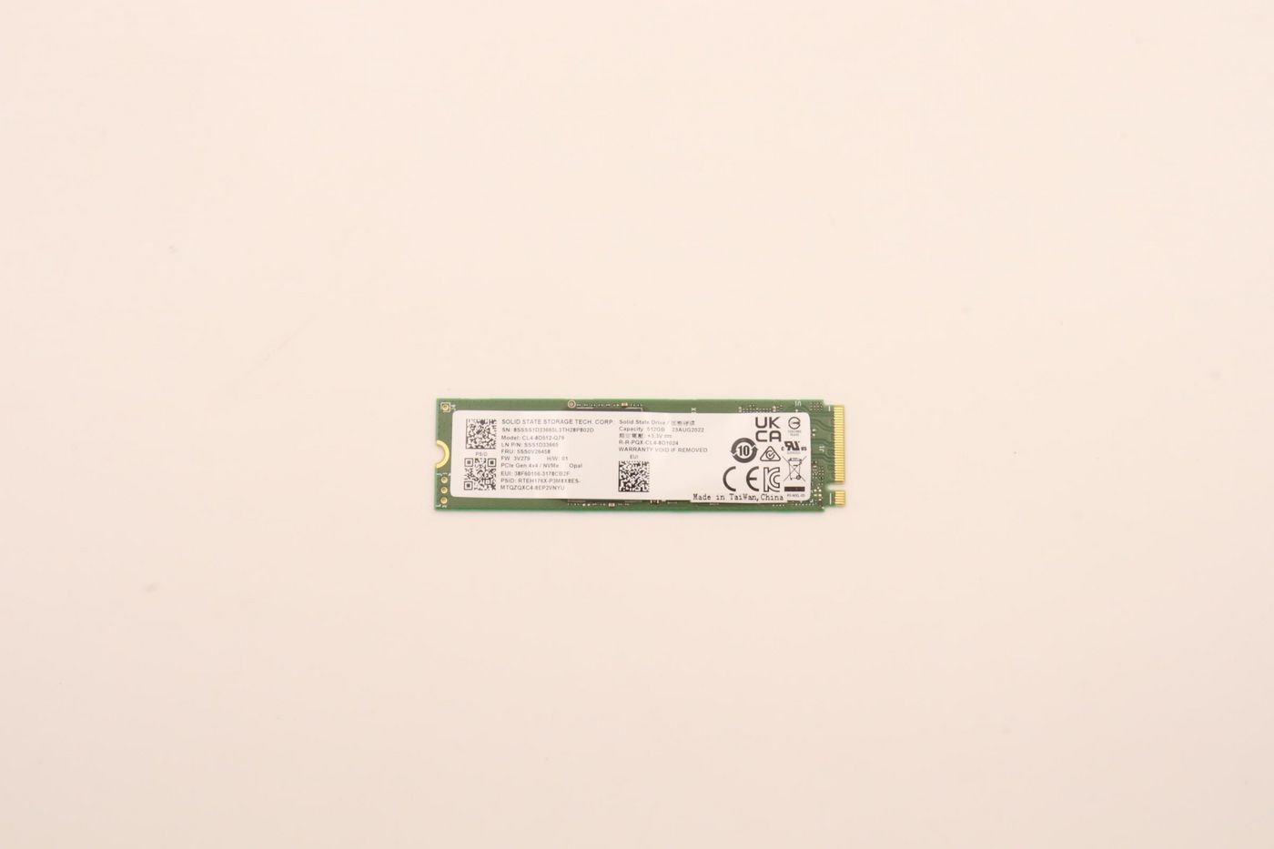 Lenovo 512GB M.2 2280 PCIe 4.0 NVMe SSD in green and silver, featuring a compact design with printed specifications and a connector on one end.