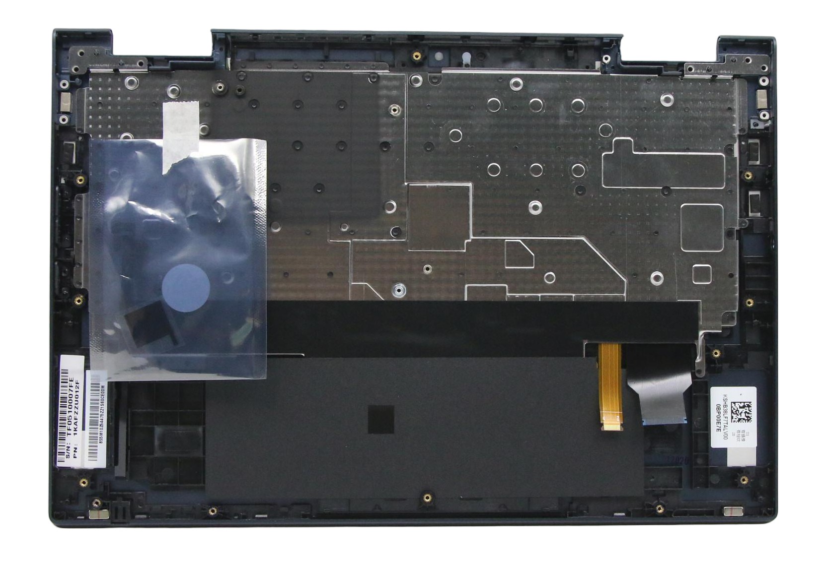 Lenovo laptop spare part cover and keyboard, featuring a black plastic base with metallic components, transparent packaging, and various small parts for assembly.