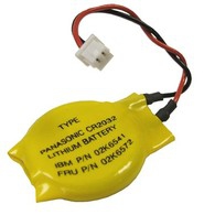 Yellow lithium backup battery with a round shape, featuring a printed label with text, and two attached wires (red and black) ending in a connector.