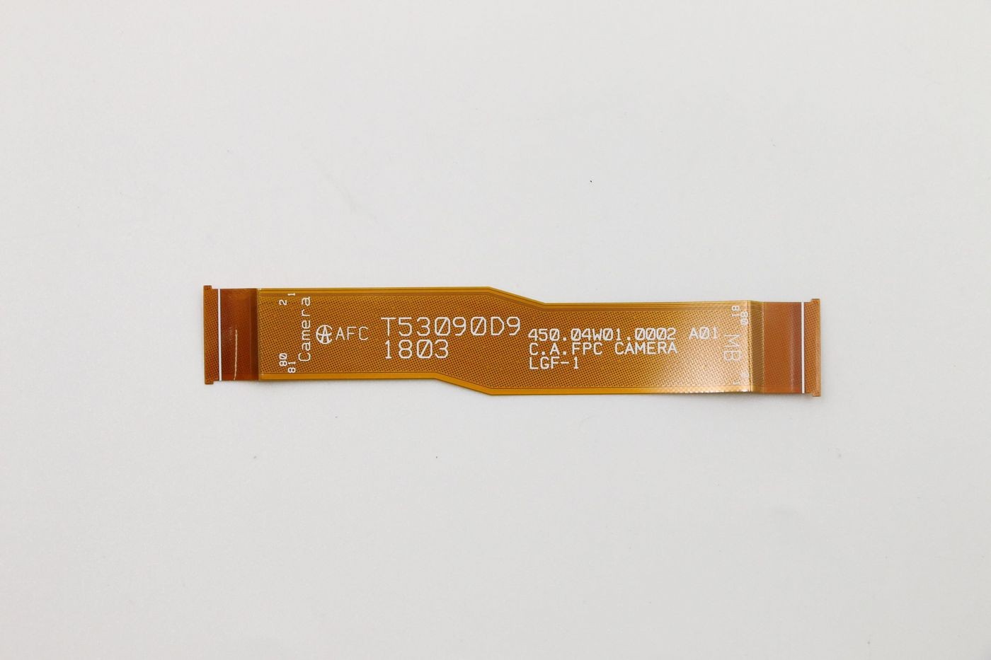 Flexible orange ribbon cable with printed text, designed for camera connections, featuring a smooth surface and thin profile.