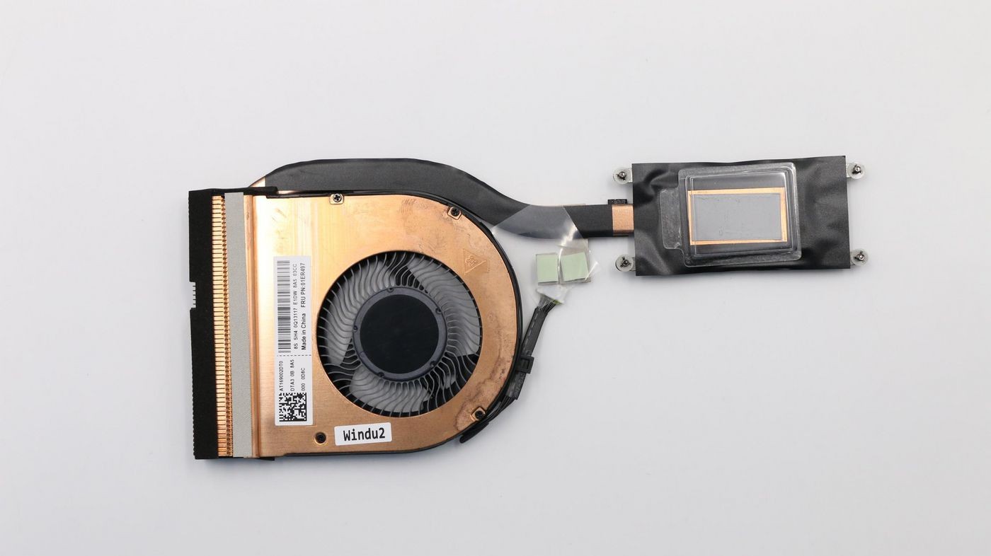 Copper and black Lenovo CPU heatsink with a fan, featuring a thermal pad and a label, designed for efficient cooling in Lenovo devices.