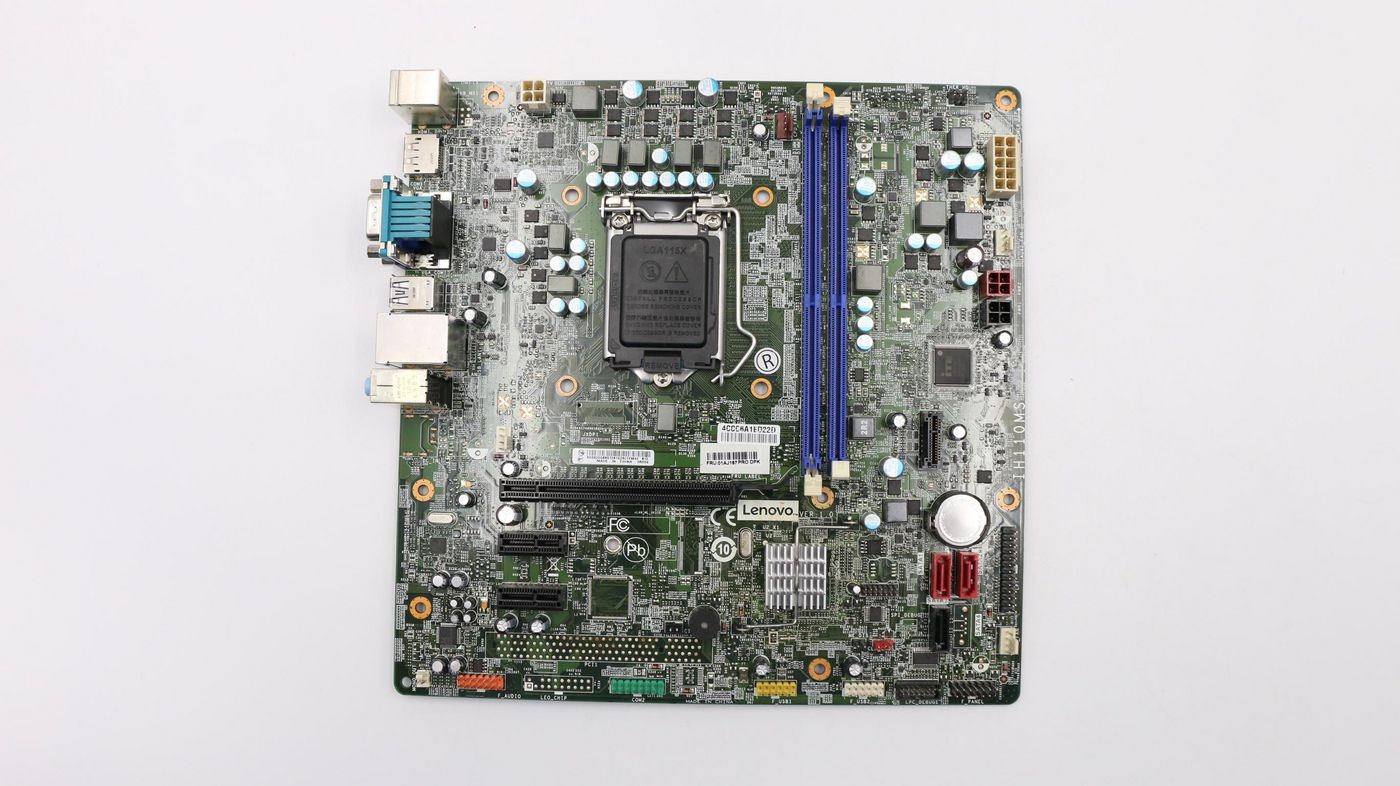Green circuit board with Lenovo branding, featuring a central CPU socket, multiple RAM slots in blue, various ports, and numerous electronic components.