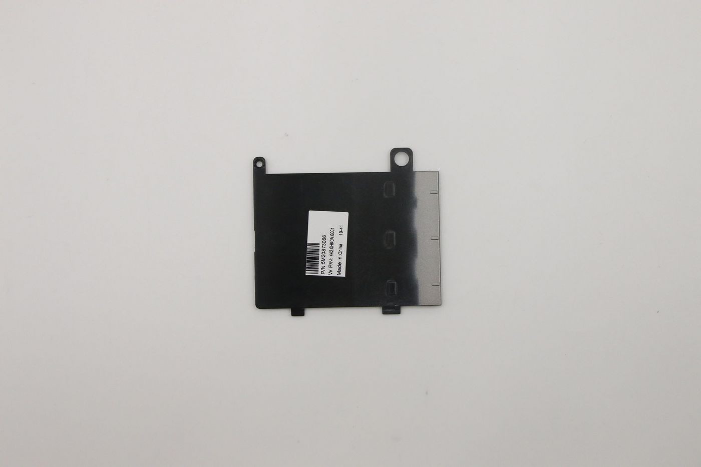 Black plastic dummy SIM card reader with a smooth surface, featuring cutouts and a label with a barcode, designed for Lenovo devices.