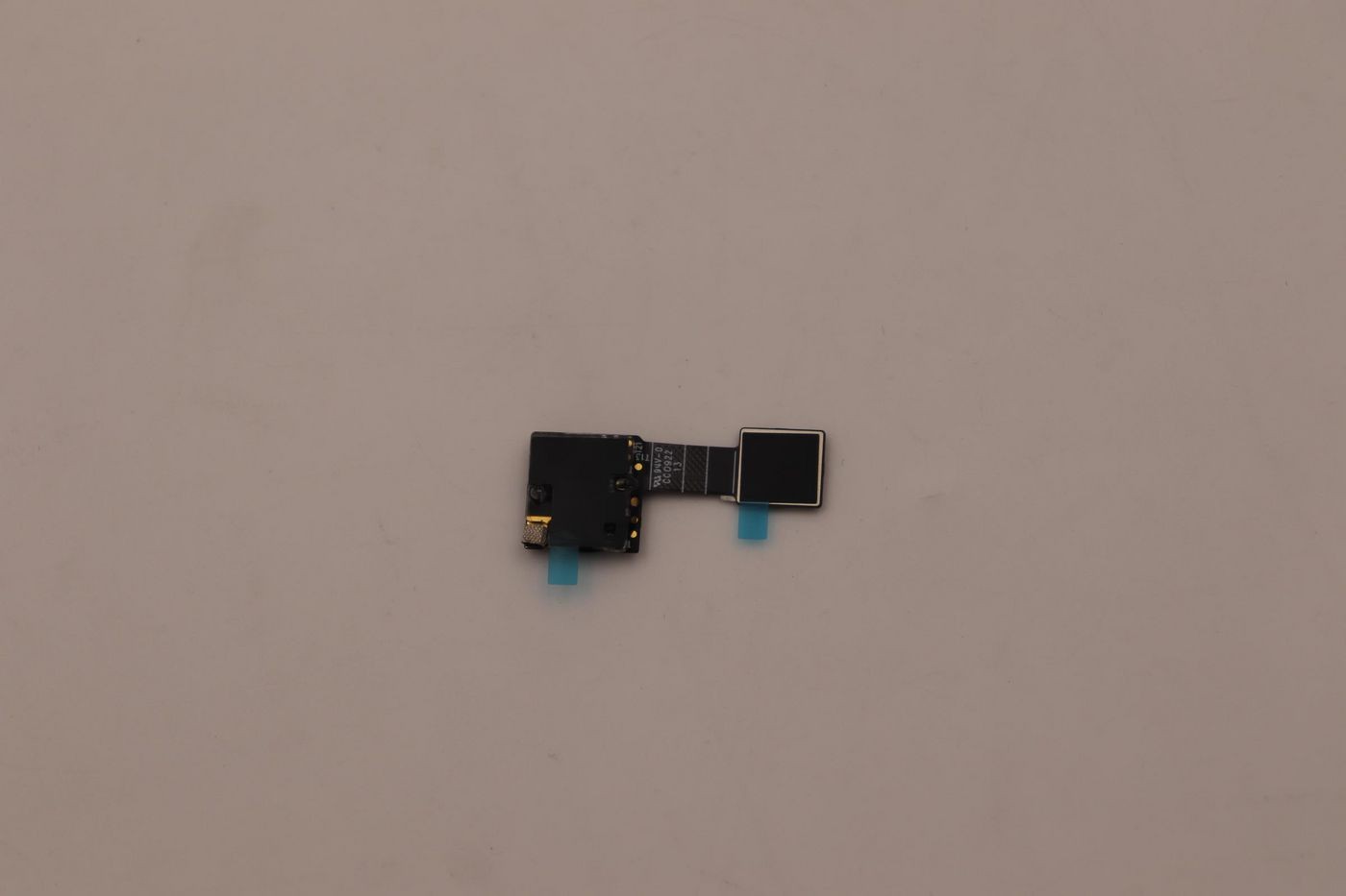 Lenovo FINGER_PR FRU FPR Round FoP in black and silver, featuring a small rectangular sensor with blue connectors, designed for fingerprint recognition.
