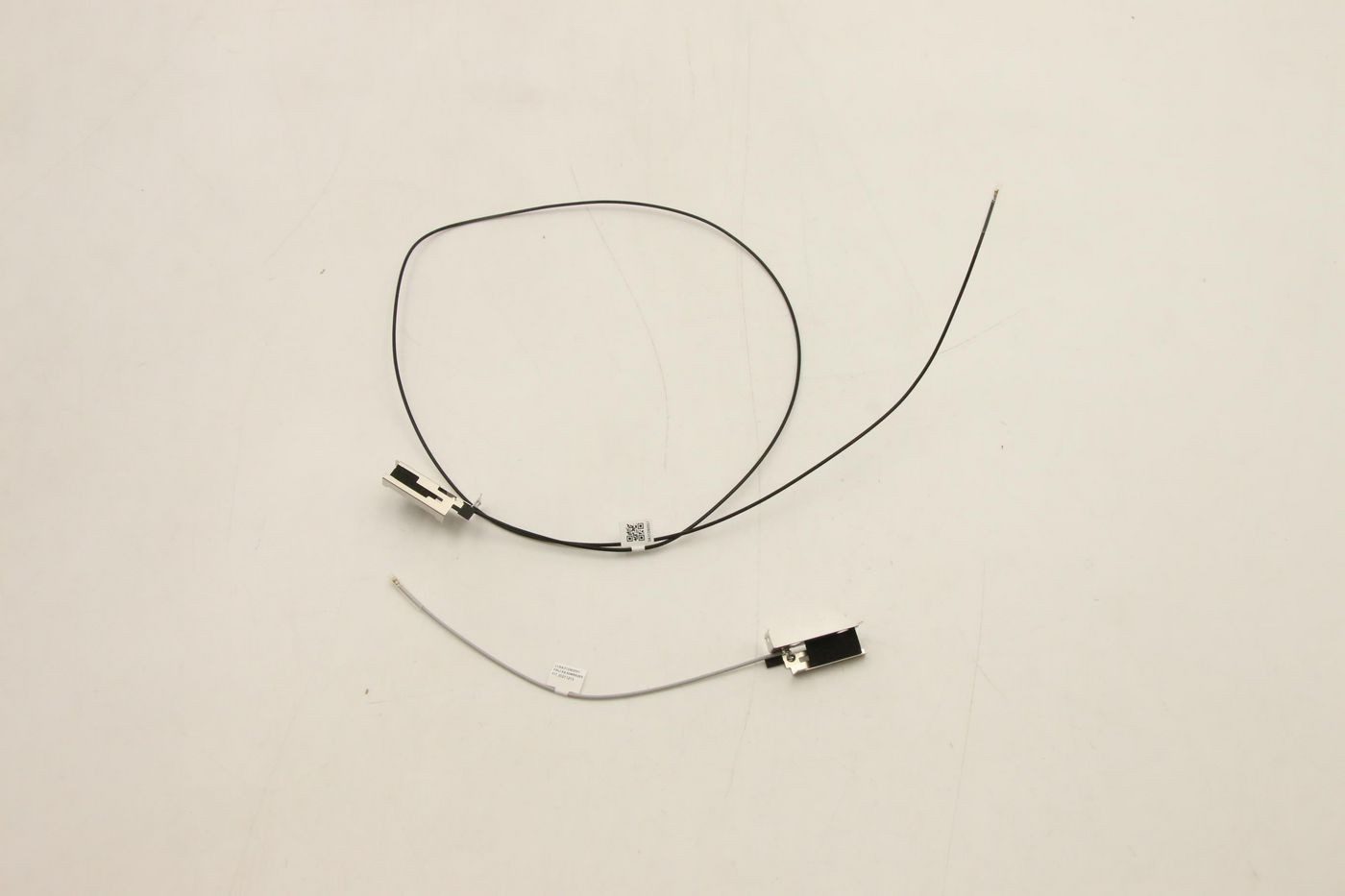 Two Wi-Fi antenna cables, one black and one white, with metal connectors at each end, designed for Lenovo devices, featuring a sleek, minimalistic design.