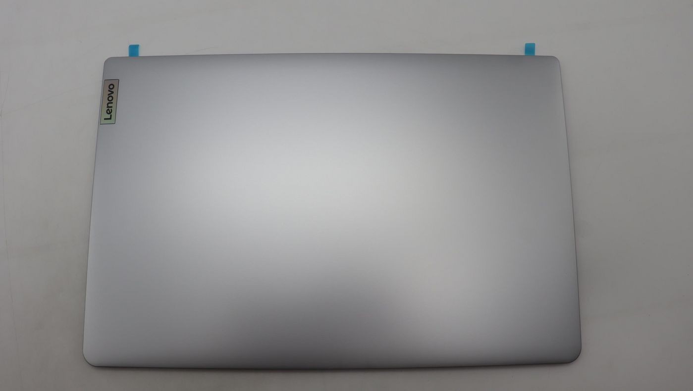 Grey LCD cover for Lenovo laptops, featuring a sleek metallic finish with a subtle Lenovo logo in the corner and blue adhesive tabs at the top.
